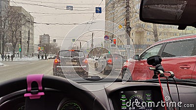 Kirov, Russia - February 14, 2023: Looking throught car window to the city street with houses Editorial Stock Photo