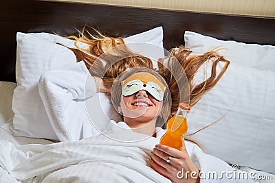 Kirov, Russia - March 02, 2019: Beautiful girl in the hotel interior. Female traveler resting in the room Editorial Stock Photo