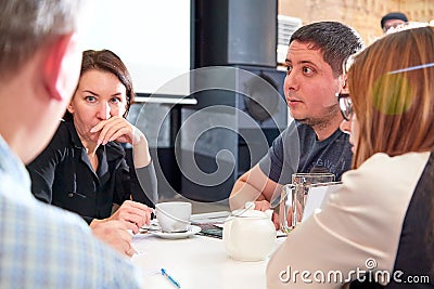 Kirov, Russia - October 02, 2019: People at table in cafe or restaurant during intellectual game. People waiting for the waiter to Editorial Stock Photo