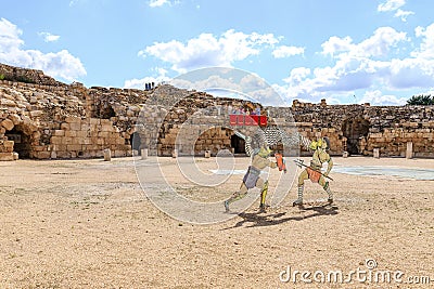 Figures of two fighting gladiators in the arena of the ancient amphitheater in the ruins of the Beit Guvrin amphitheater, near Editorial Stock Photo