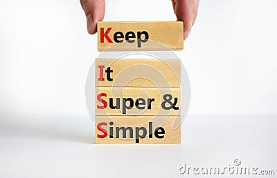 KISS keep it super and simple symbol. Concept words KISS keep it super and simple wooden blocks. Beautiful white table, white Stock Photo