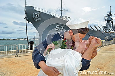 The Kiss Statue. USS Missouri on the background Editorial Stock Photo