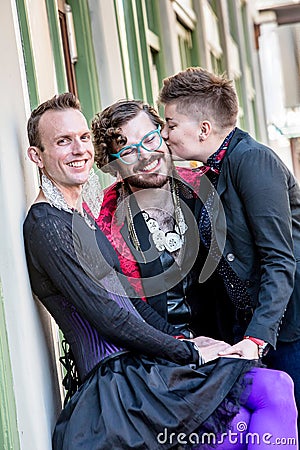 A Kiss Among Three Gender Fluid Friends Stock Photo