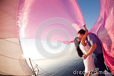 Kiss under the sail Stock Photo