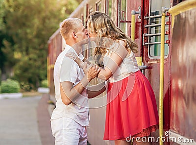 Kissing couple on the trailway station . Stock Photo