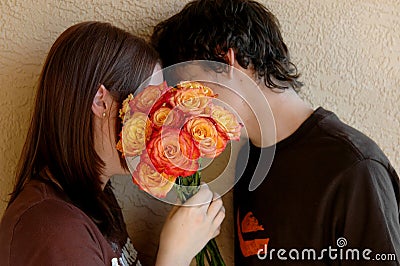 Kissing teens Stock Photo