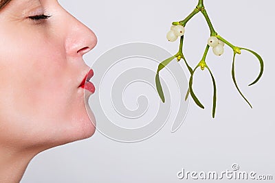 Kissing under the mistletoe Stock Photo