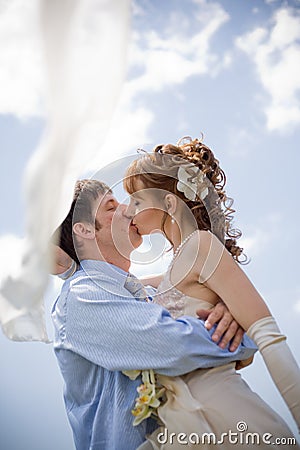 Kissing wedding couple Stock Photo