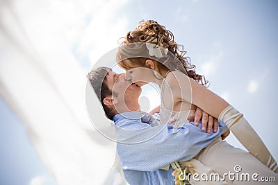 Kissing wedding couple Stock Photo