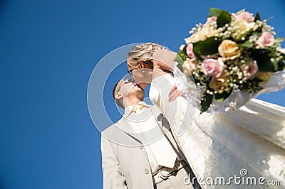 Kissing wedding pair Stock Photo