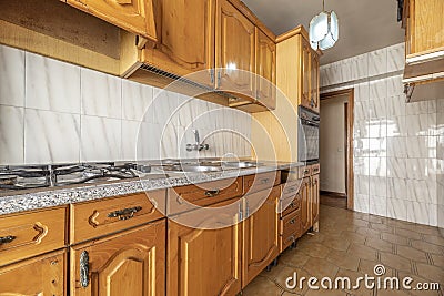 Kitchen with Castilian-style wooden furniture in gloss varnished pine, Stock Photo