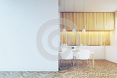 Kitchen counter, dining table and a blank wall, toned Stock Photo