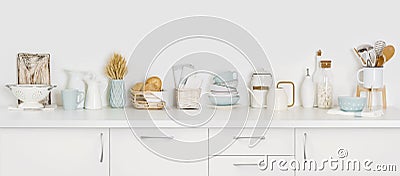 Kitchen counter full of various utensils isolated on white background Stock Photo