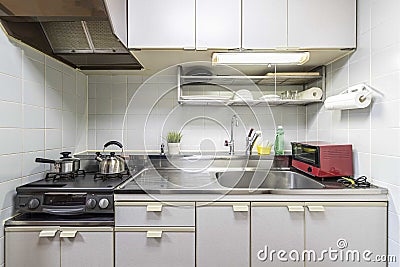 Kitchen counters and kitchen utensils in the room at the condominium Stock Photo