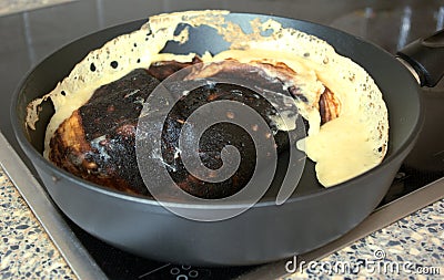 Kitchen fail. Burned dish closeup Stock Photo