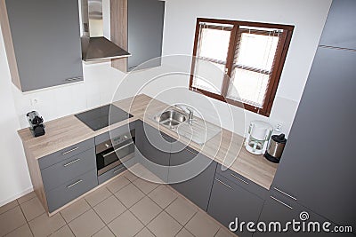Kitchen grey and wood with window Stock Photo