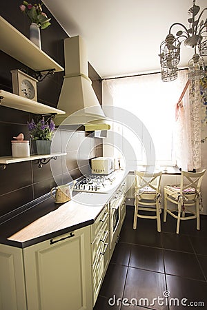 Kitchen interior in bright colors stove refrigerator chairs Editorial Stock Photo