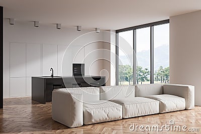 Kitchen interior with countertop, couch and bar chairs near panoramic window Stock Photo