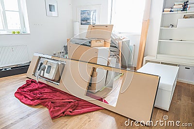 Kitchen laid out in the living room, disassembled into individual parts Stock Photo