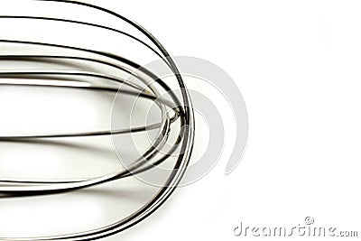 Kitchen manual metal whisk detail. Abstract shot. Stock Photo