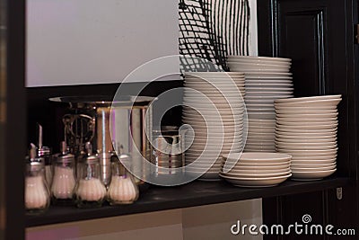 Kitchen in the restaurant. Kitchen inverter on the bar counter. Clean pasta, plates. The concept of a restaurant Stock Photo