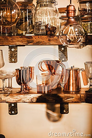 Kitchen shelves with various glass and utencils in daylight Stock Photo