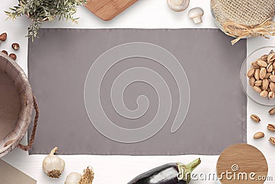 Kitchen table cloth surrounded with ingredients, spices and items for storing food Stock Photo