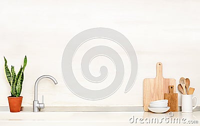 Kitchen table top with sink and utensils Stock Photo