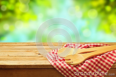 Kitchen utensil over garden background Stock Photo