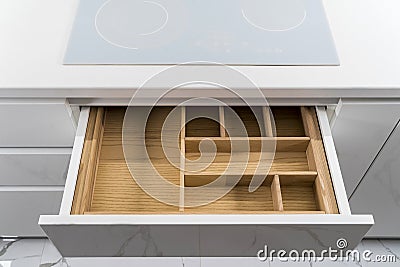 Kitchen utensils in drawer. Forks, spoons and knives. Stock Photo