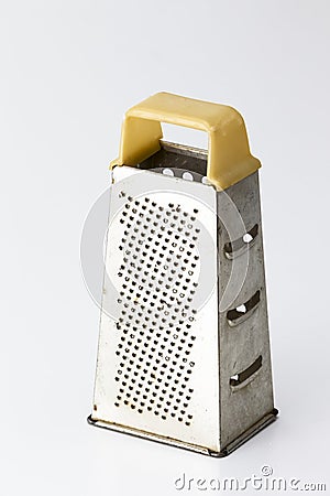 Kitchen Utensils Ideas. Old and Rusty Used Grater Made of Stainless Steel Isolated Over Pure White Background Stock Photo