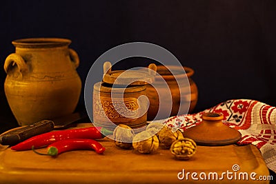 kitchen utensils and kitchenware,spoons, and pods of hot red pepper Stock Photo