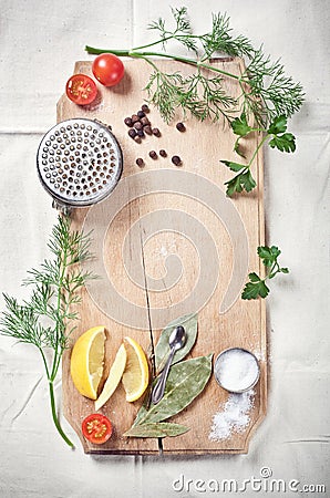 Kitchen utensils, spices and herbs for cooking fish Stock Photo