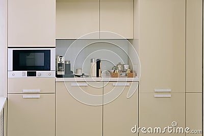 Symple beige furniture in kitchen room Stock Photo