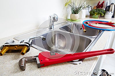 Kitchen Water tap and sink. Stock Photo