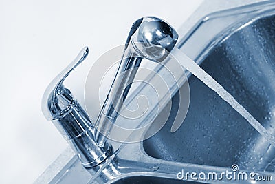 Kitchen Water tap and sink. Stock Photo