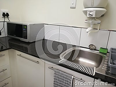 Office Kitchenette on display with microwave [5] Stock Photo