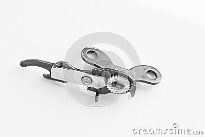 Kitchenware - can opener on a light background. Stock Photo