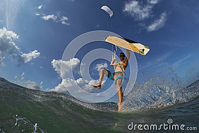 Kite surfer jumps with kiteboard Stock Photo