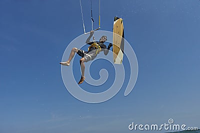 Kite surfer rjumps with kiteboard Stock Photo