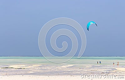 Kite surfing on tropical beach, low tide. Kite surfers on the sea. Scenic Indian Ocean with kite boards, Zanzibar, Paje beach. Editorial Stock Photo