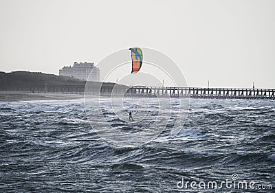 Kiteboarder kitesurfer extreme water sport at Belgium Pier in Blankenberge north sea atlantic ocean West Flanders Stock Photo