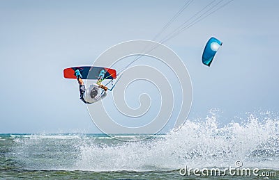 Kiteboarder kitesurfer man athlete jumping, kitesurfing kiteboarding jump Stock Photo