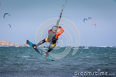 Kiteboarder kitesurfer man athlete jumping, kitesurfing kiteboarding jump Editorial Stock Photo
