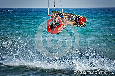 Kiteboarder, kitesurfer performing kiteboarding kitesurfing tricks on the water Editorial Stock Photo