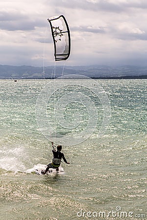 Kiteboarder surfing waves with kiteboard Stock Photo