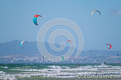 Kiteboarding kitesurfing kiteboarder kitesurfer kites on the ocean beach Stock Photo