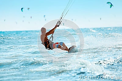 Kiteboarding, Kitesurfing. Water Sports. Kitesurf Action On Wave Stock Photo