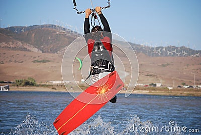 Kiter flying on the waves near Tarifa, Spain Stock Photo