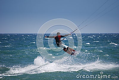 Kiter flying on the waves near Tarifa, Spain Stock Photo
